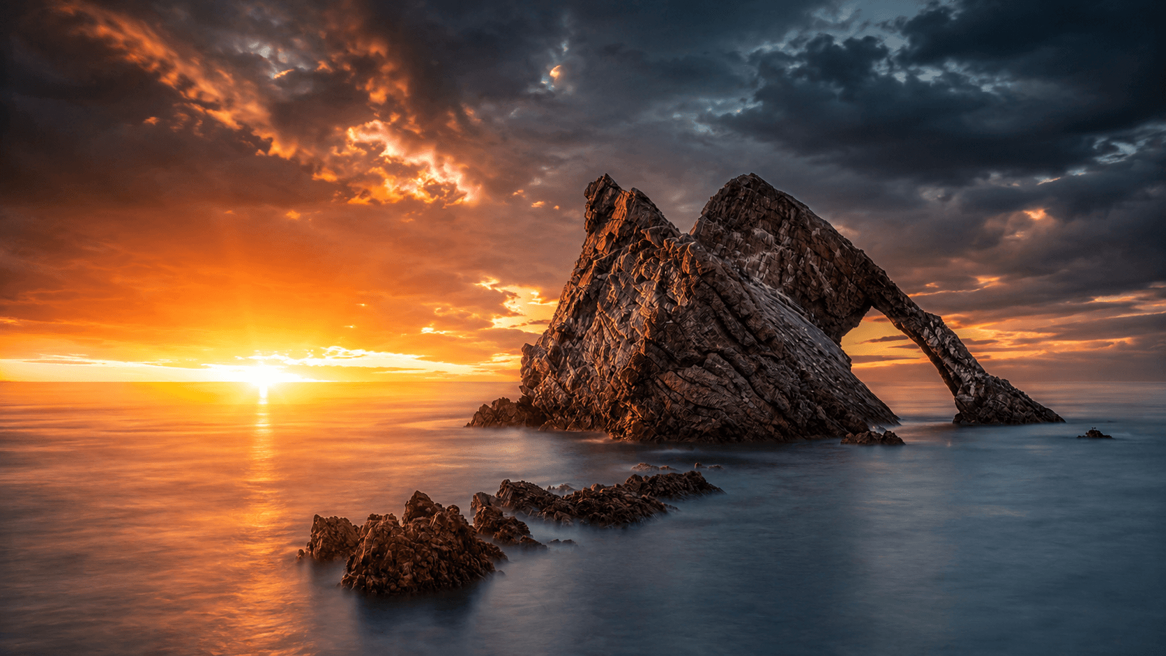 Long exposure photograph of Bow Fiddle Rock in Scotland